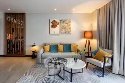 Elegant living room with modern decor, stylish furniture, and ambient lighting, perfect for relaxation and entertaining.