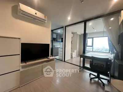Modern apartment interior with open layout, featuring a living area, kitchen, and bedroom with city view.
