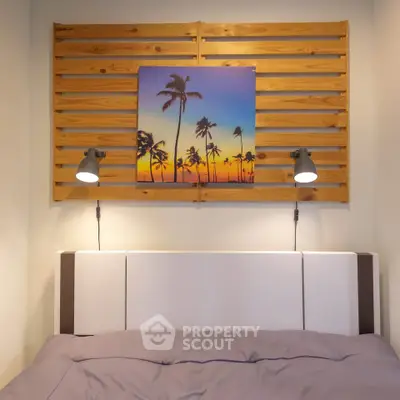 Cozy bedroom with stylish wall art and modern lighting