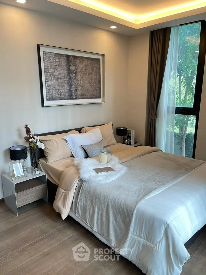 Luxurious bedroom with elegant decor and large window view