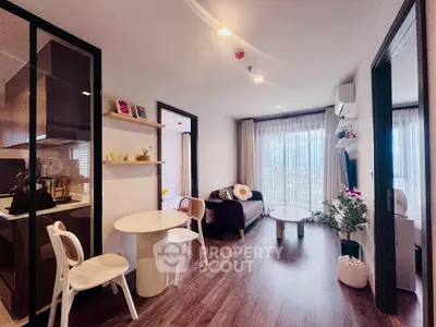 Modern open-layout living room with cozy decor and natural light