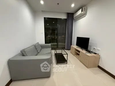 Modern living room with sleek furniture and city view