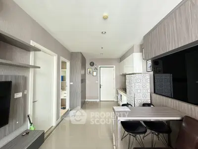Modern open-plan living room with sleek kitchen and stylish dining area