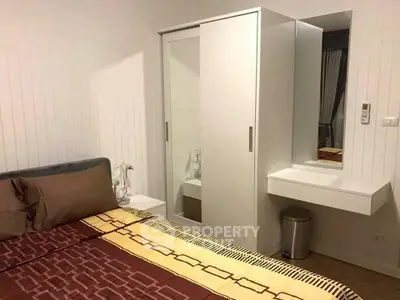 Cozy bedroom with modern wardrobe and stylish decor