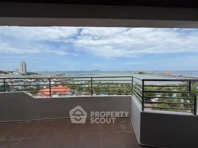 Stunning balcony view overlooking the ocean and city skyline, perfect for relaxation and enjoying sunsets.