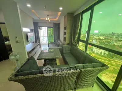 Spacious living room with panoramic city view and modern furnishings.