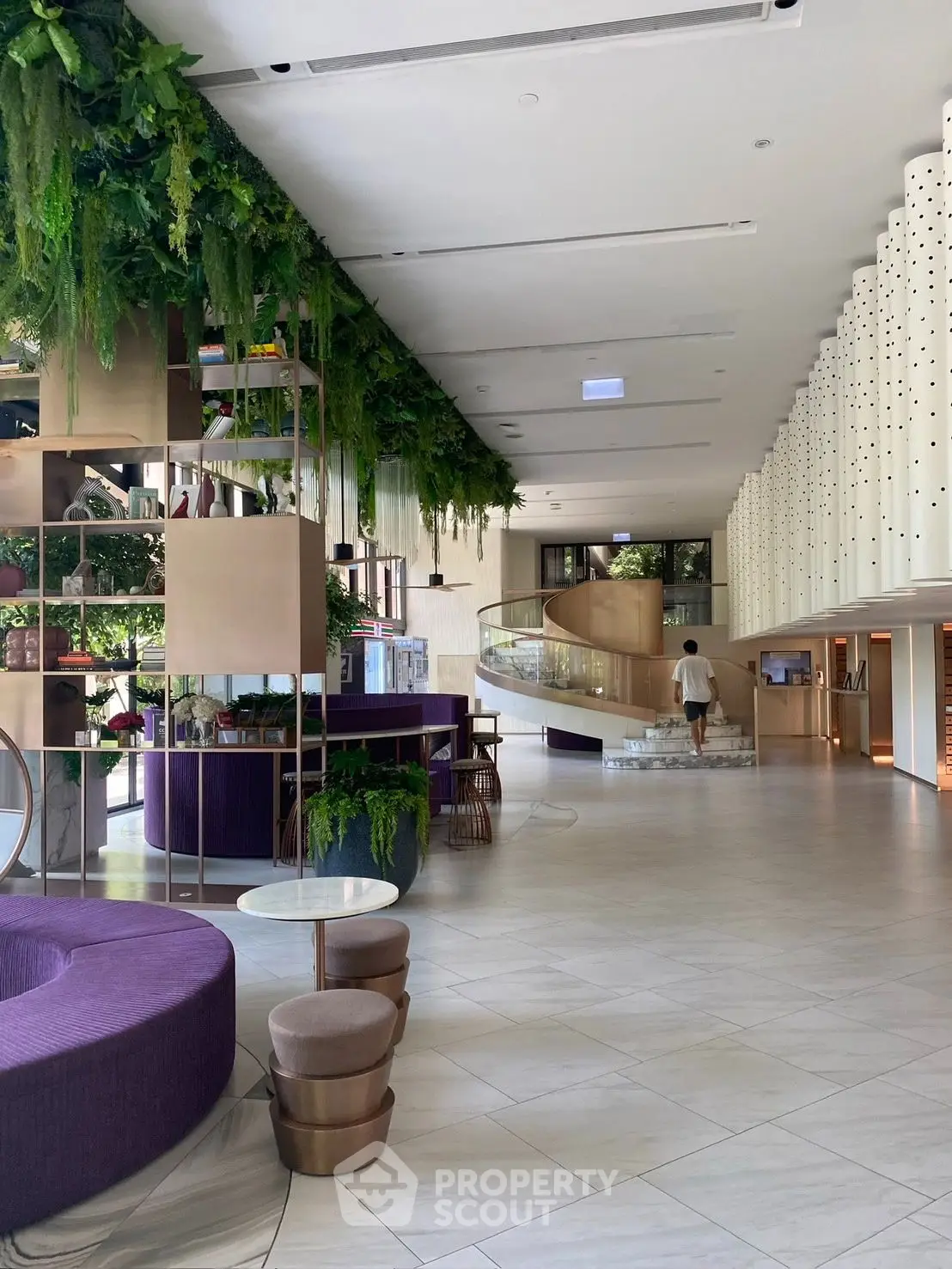 Luxurious modern lobby with green accents and elegant design features.