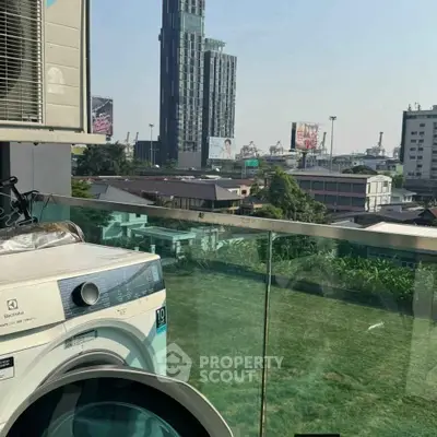 Modern balcony with washing machine and city view, perfect for urban living.
