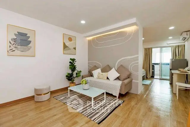 Modern living room with stylish decor and cozy ambiance in a contemporary apartment.