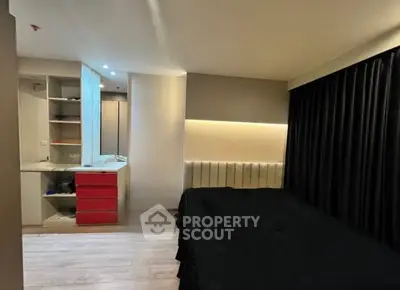 Modern bedroom with sleek design and ambient lighting