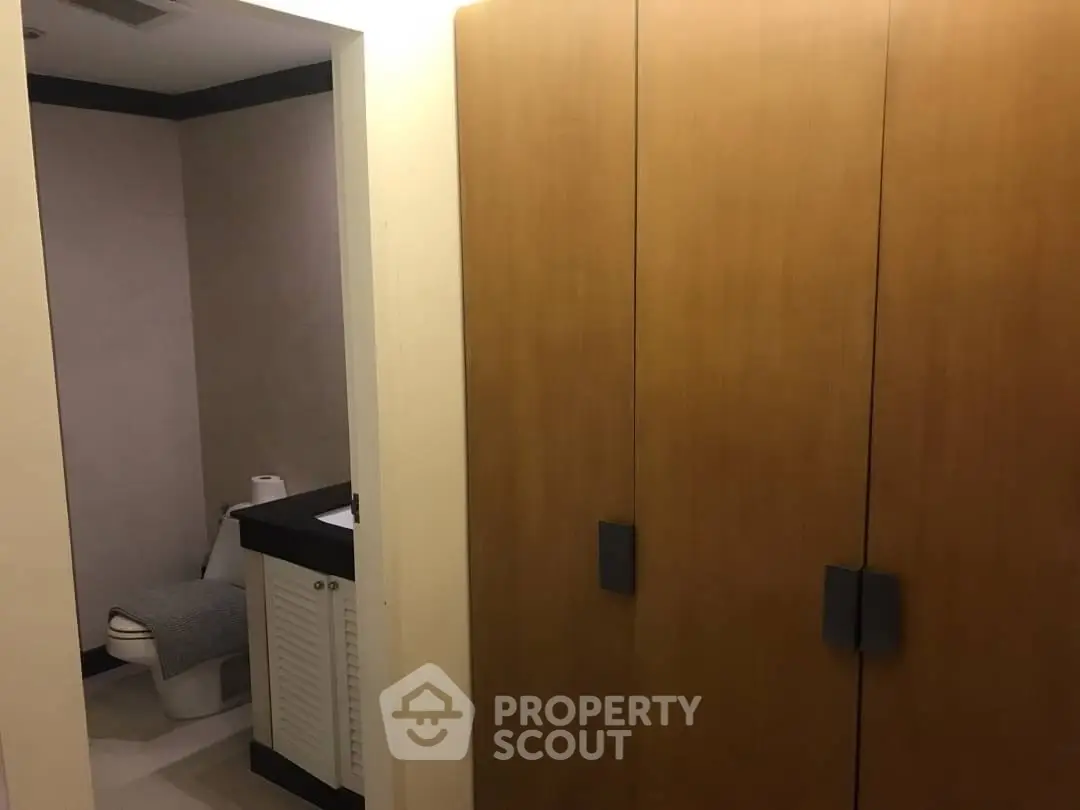 Cozy bathroom with wooden cabinets and modern fixtures