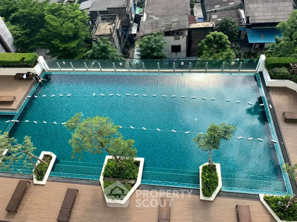 Stunning rooftop pool with city view, perfect for relaxation and leisure in urban setting.
