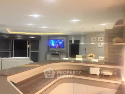Luxurious open-layout kitchen with modern design and spacious living area, perfect for entertaining.