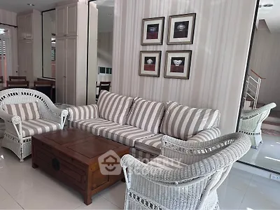 Charming living room with striped furniture and elegant decor