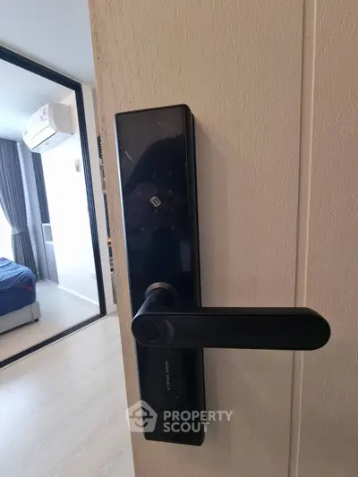Modern smart lock on a bedroom door with sleek design and advanced security features.