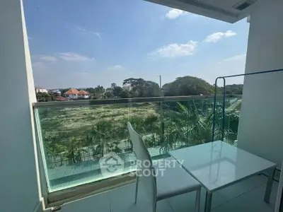 Spacious balcony with scenic view and modern furniture, perfect for relaxation and enjoying the outdoors.