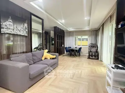 Spacious modern living room with elegant decor and cozy seating area.