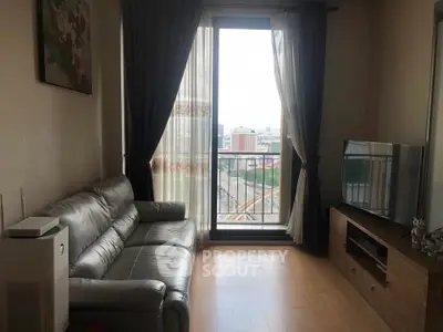 Modern living room with leather sofa and city view from balcony, perfect for urban living.