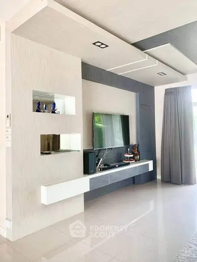 Modern living room with sleek TV unit and elegant decor