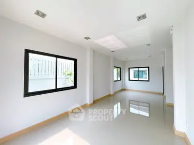 Spacious modern interior with large windows and glossy floors