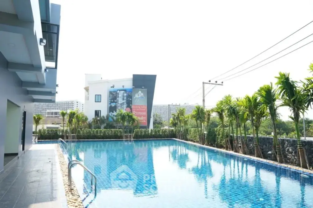 Luxurious residential pool with modern architecture and lush greenery