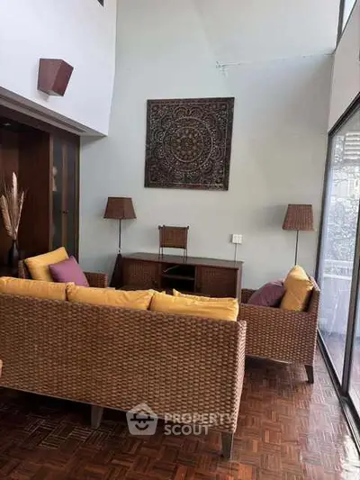 Charming living room with wicker furniture and elegant decor