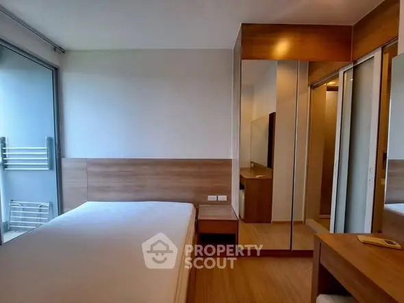 Modern bedroom with wooden accents and mirrored wardrobe