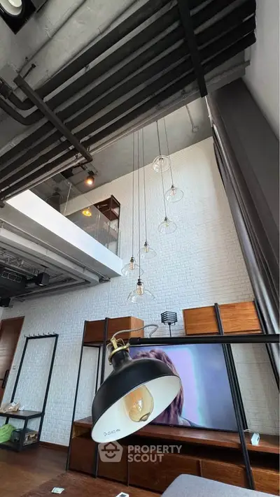 Modern loft interior with high ceilings and stylish lighting fixtures