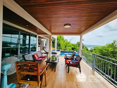 Stunning balcony with pool and ocean view, perfect for relaxation and entertainment.