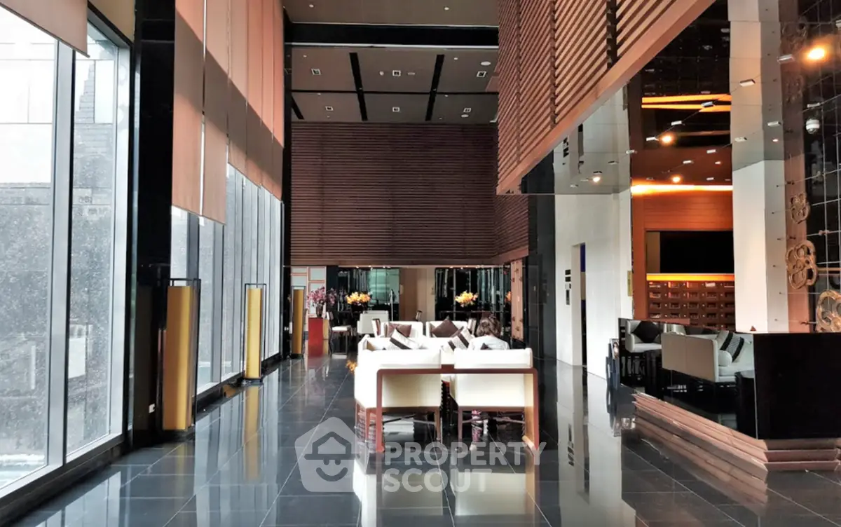 Luxurious modern lobby with high ceilings and elegant seating area