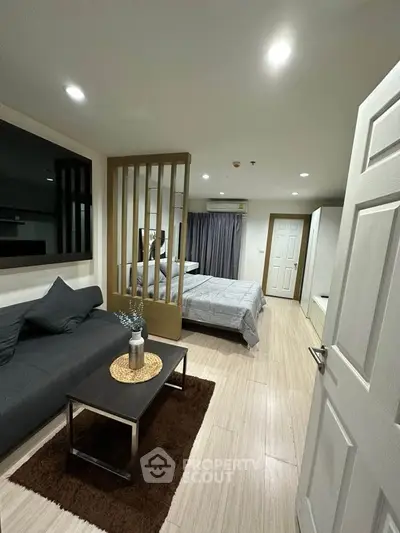Modern studio apartment with open layout and stylish furnishings