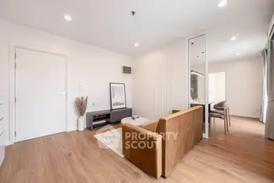 Modern living room with stylish decor and open dining area