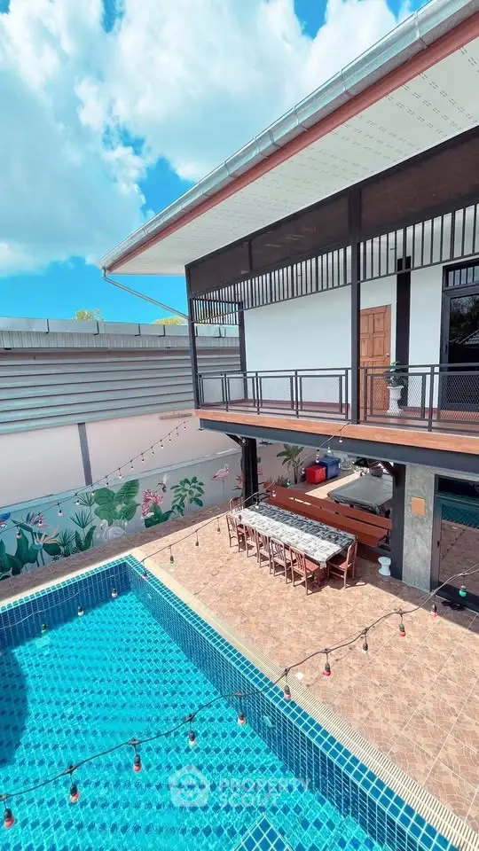 Stunning modern home with a spacious outdoor pool and stylish patio area, perfect for entertaining.