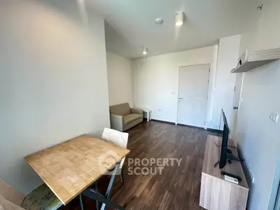 Modern living room with wooden flooring and minimalist furniture