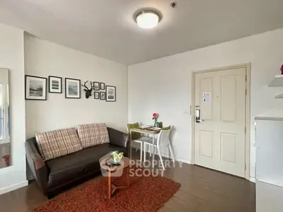 Cozy living room with stylish decor and dining area in modern apartment.