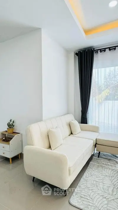 Modern living room with elegant white sofa and natural light