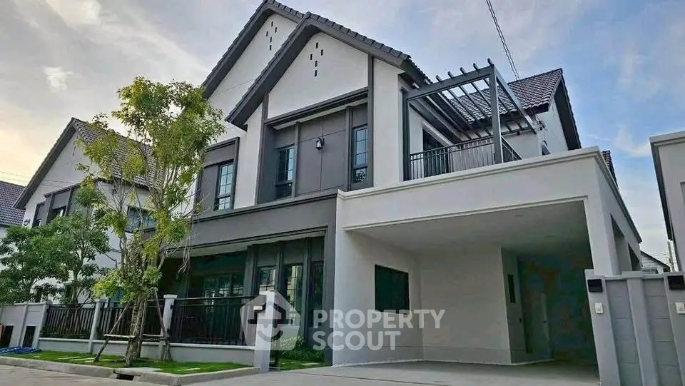 Modern two-story house with sleek design and spacious driveway