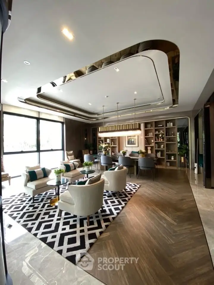 Luxurious modern living room with elegant decor and large windows offering natural light.