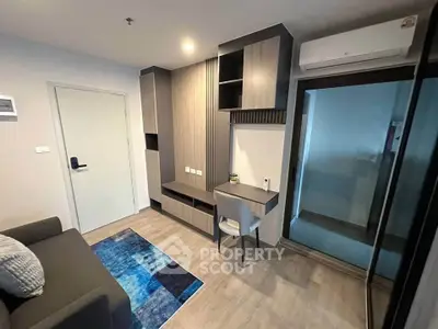 Modern living room with sleek furniture and air conditioning in a stylish apartment.
