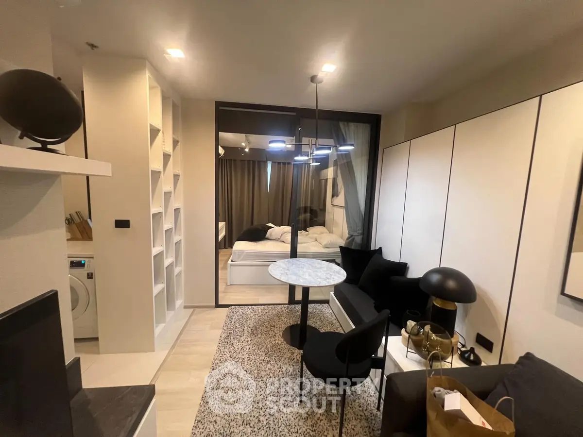 Modern studio apartment with open living area and cozy bedroom