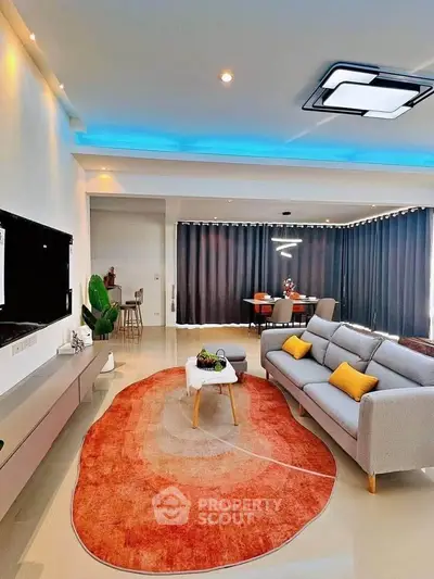 Modern living room with stylish decor, featuring a cozy sofa, vibrant rug, and ambient lighting.