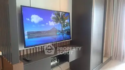 Modern living room with sleek TV setup and stylish cabinetry