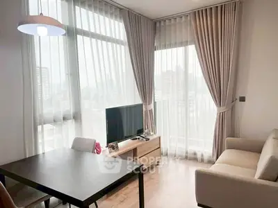 Bright modern living room with large windows and city view