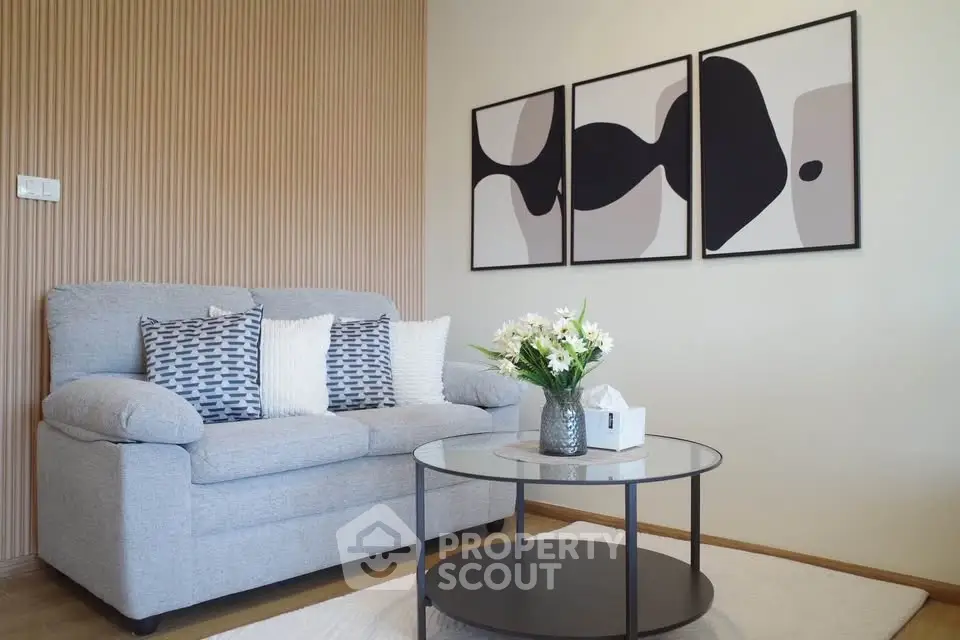 Stylish living room with modern decor and cozy sofa, perfect for relaxation.