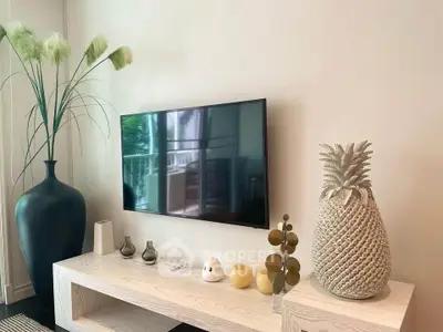 Stylish living room with modern decor and wall-mounted TV, perfect for contemporary living.