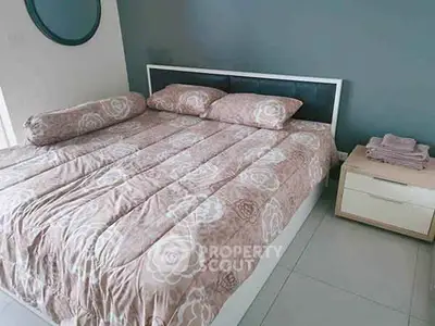 Cozy bedroom with modern decor and comfortable bedding in a stylish apartment.