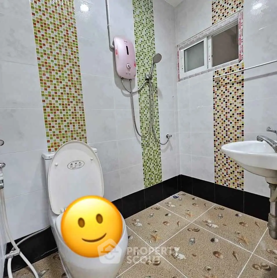 Modern bathroom with colorful tile accents and water heater