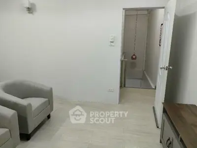 Modern minimalist living room with neutral tones and stylish furniture