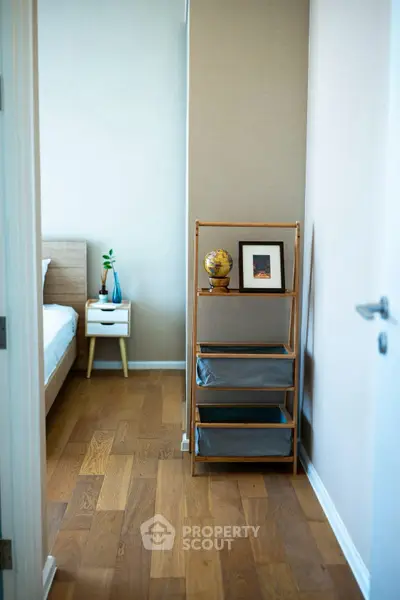 Stylish bedroom with wooden flooring and modern decor