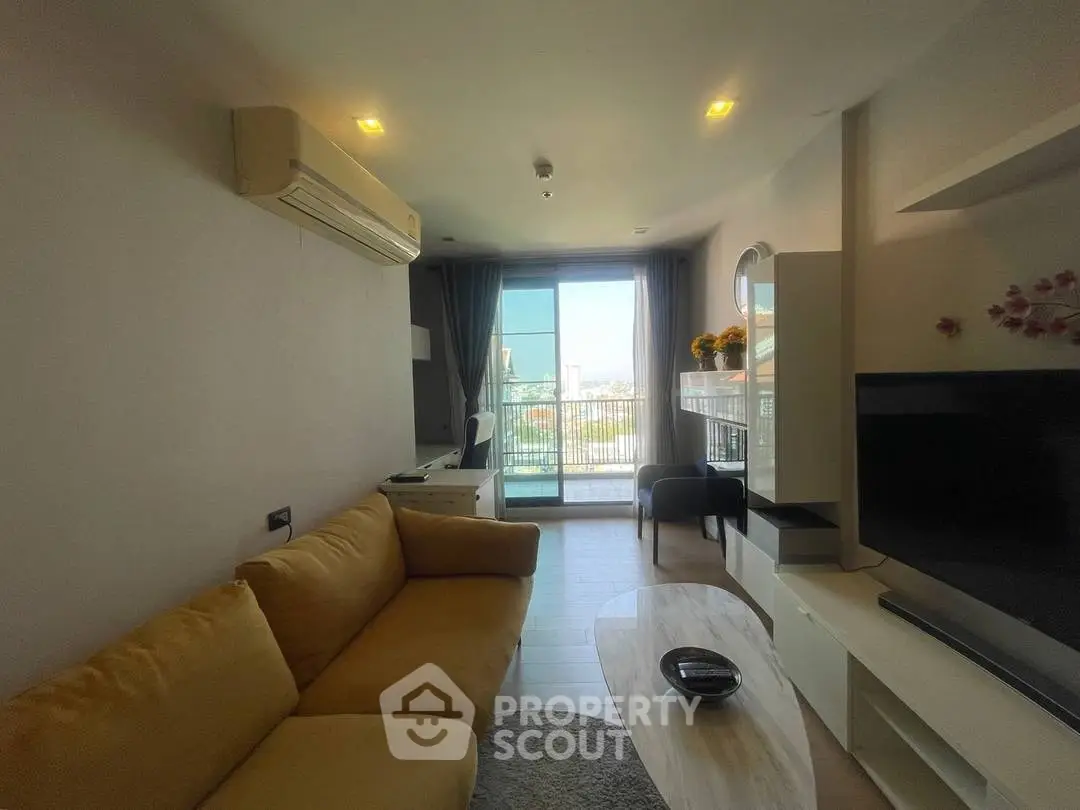 Modern living room with yellow sofa and city view balcony